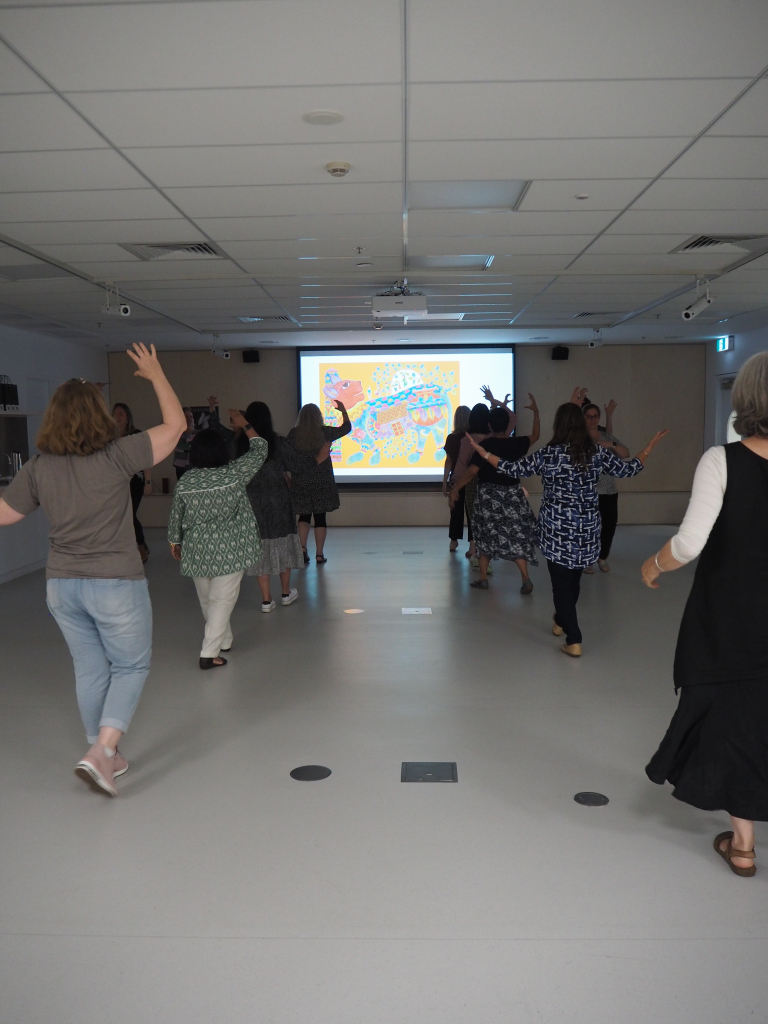 Group participating in a choreographed dance together
