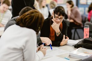 Adult learners participating in an English language class.