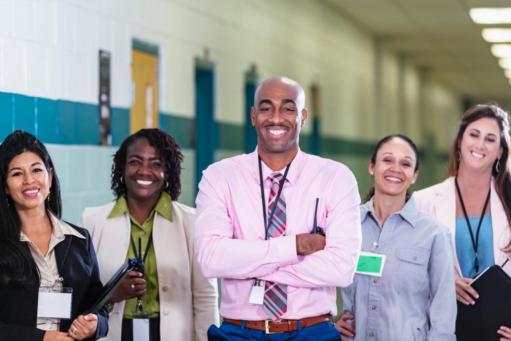 Adult learners and educator participating in an English language learning class.