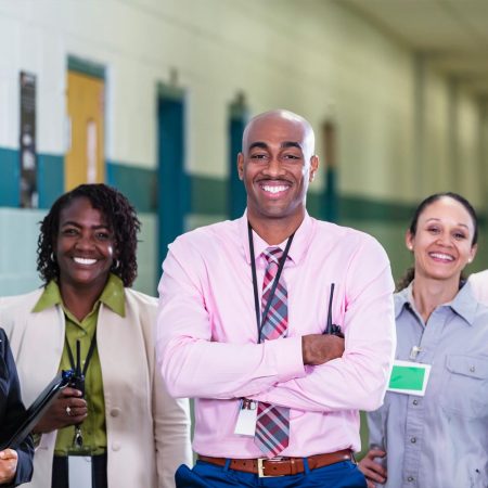 Adult learners and educator participating in an English language learning class.